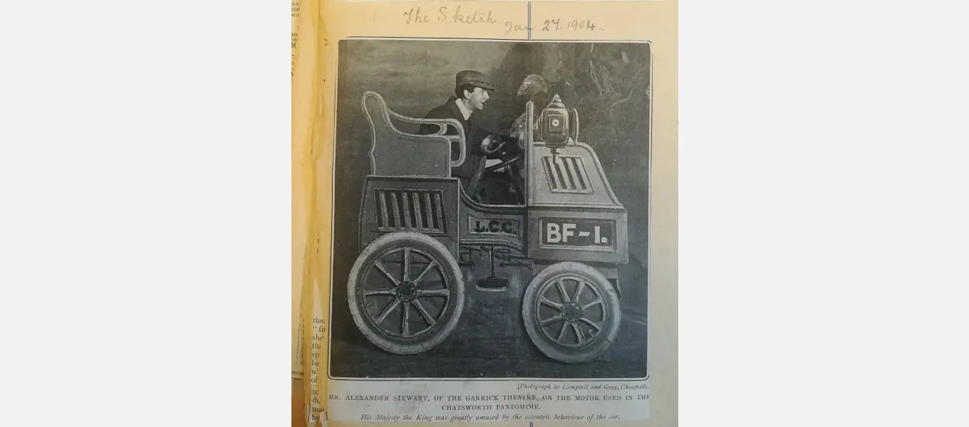 The image caption reads: ‘Mr. Alexander Stewart, of the Garrick Theatre, on the motor used in the Chatsworth pantomime.’ From the Grafton Papers (CH11/1/4)