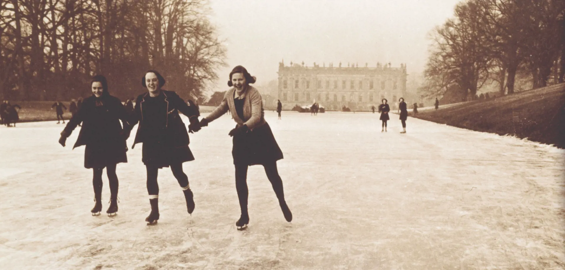 Schoolgirls from Penrhos college ice skating in front of Chatsworth House
