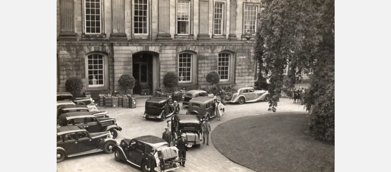 Some Penrhos girls arrived by train, while others were dropped off by their parents when petrol rationing allowed. Spot the trunks stacked up in the porch of the North Front entrance, as well as those huddled together outside.