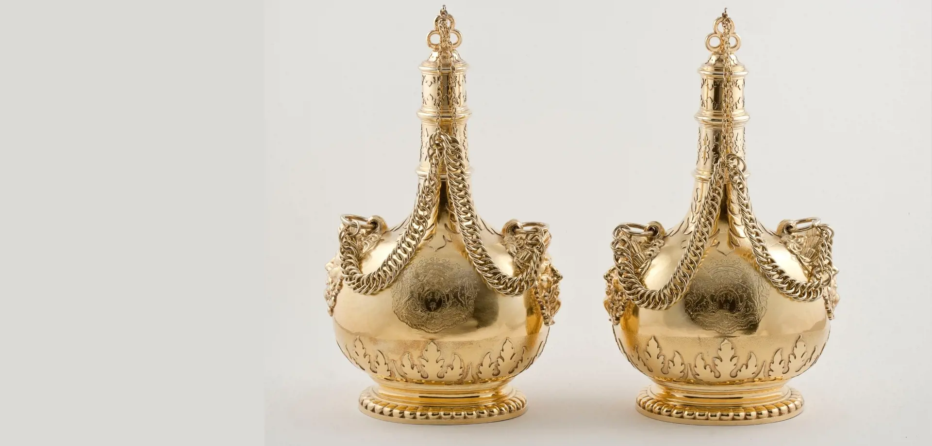 A pair of Dutch silver-gilt pilgrim bottles