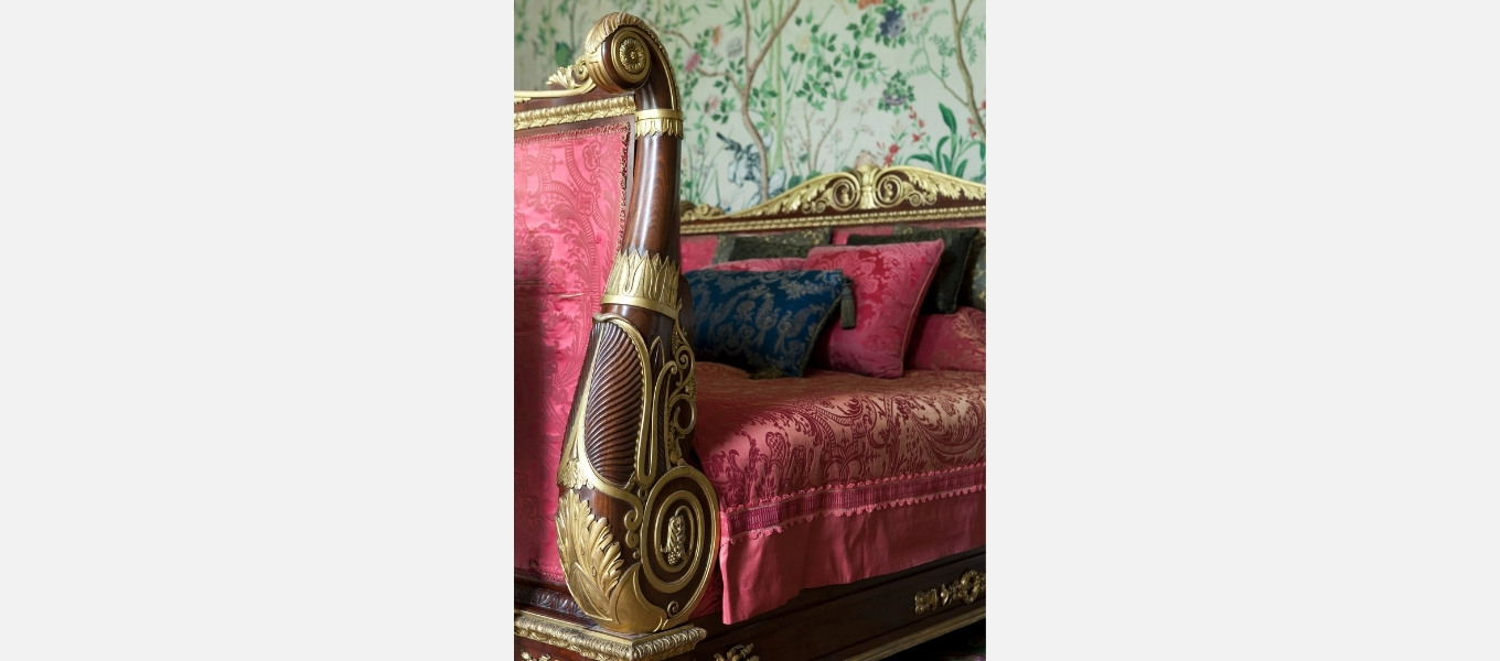 A Regency mahogany and parcel-gilt bed displayed in the Leicester bedroom