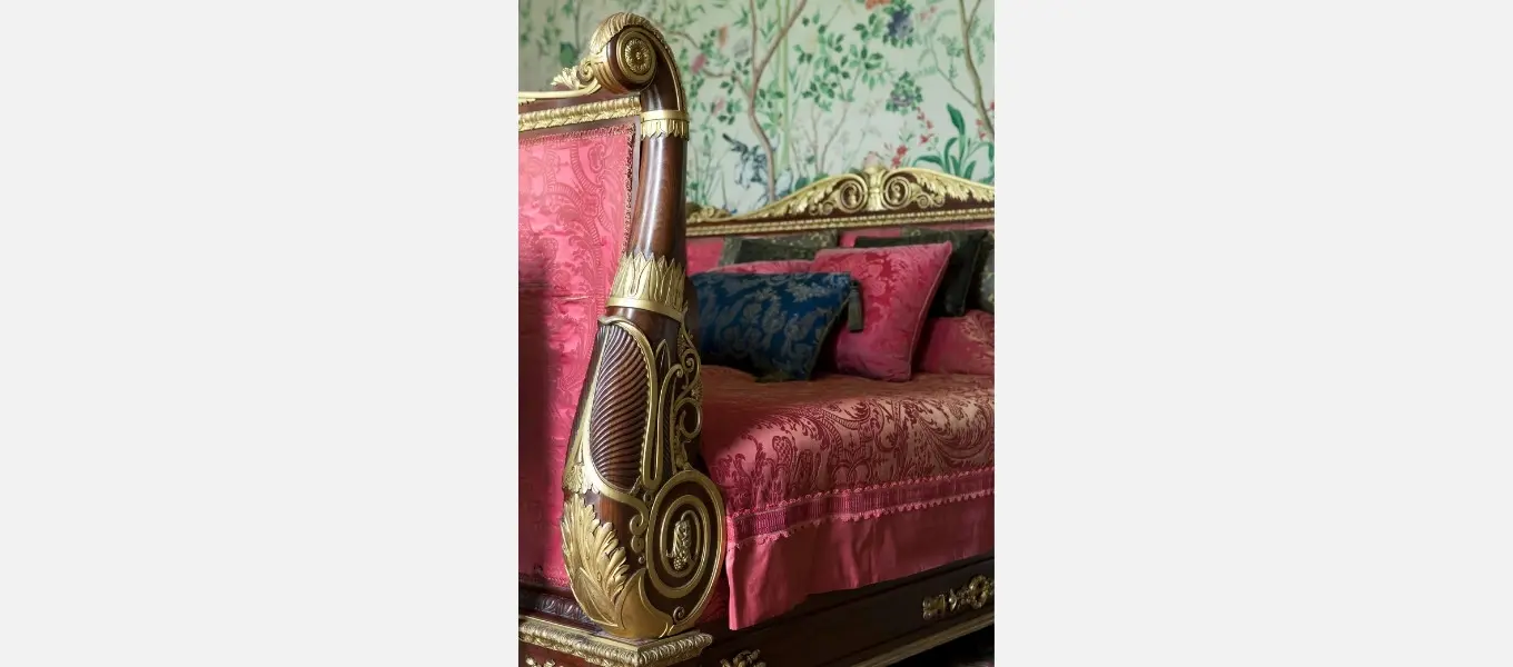 A Regency mahogany and parcel-gilt bed displayed in the Leicester bedroom